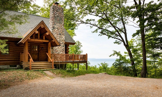 Lake Leelanau Cabin | Secluded Log Cabin Retreat on 11 Wooded Acres with Hot Tub & Lake Michigan Views