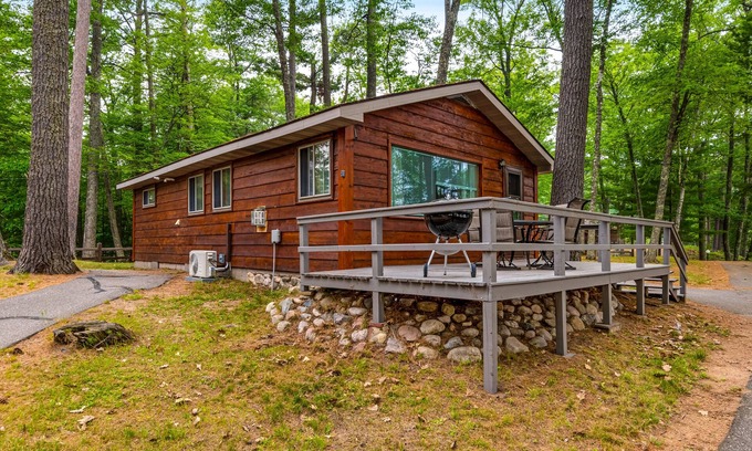 St Germain Cabin | Snowy lake-view cabin with fireplace, full kitchen, TV, dock, & DVD player