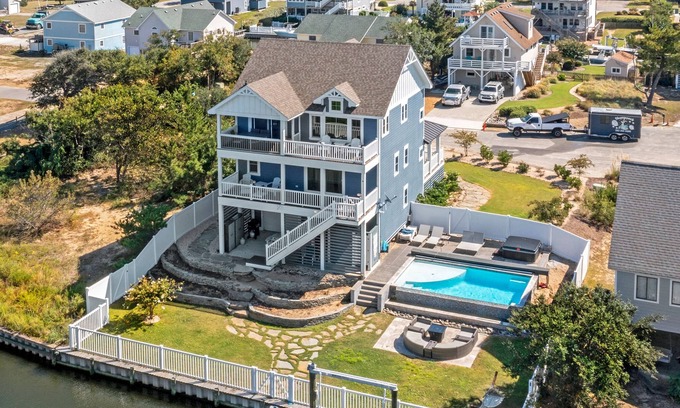 Nags Head House | Sound Living: Exquisite Canal-front home, Infinity Pool, Hot Tub, Elevator