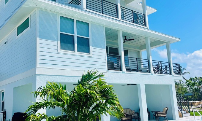 South Island House | Spacious 5-bedroom house w/Elevator, Canal, and heated pool Fort Myers Beach
