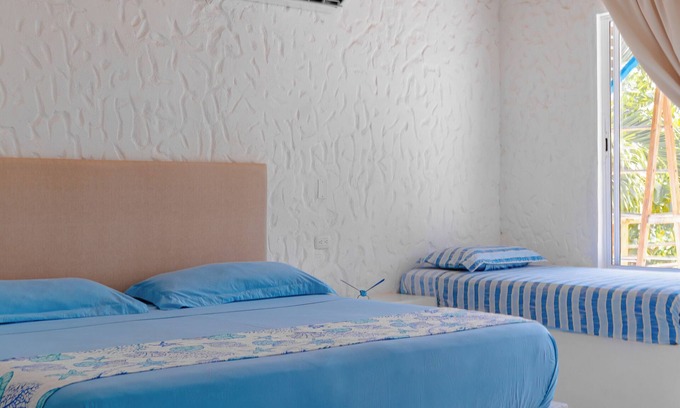 Rincon Apartment | Spacious beachfront house in Rincón del Mar, white, comfortable, fresh and bright.