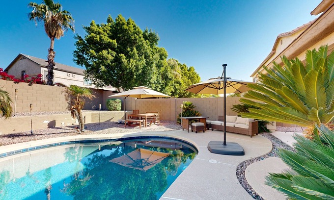 Glendale House | Spacious home surrounded by palms with pool, grill, children's items, & W/D