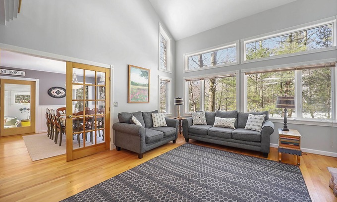Maple City House | Spacious home with studio, lake access, sunroom, fireplace, W/D, & central AC