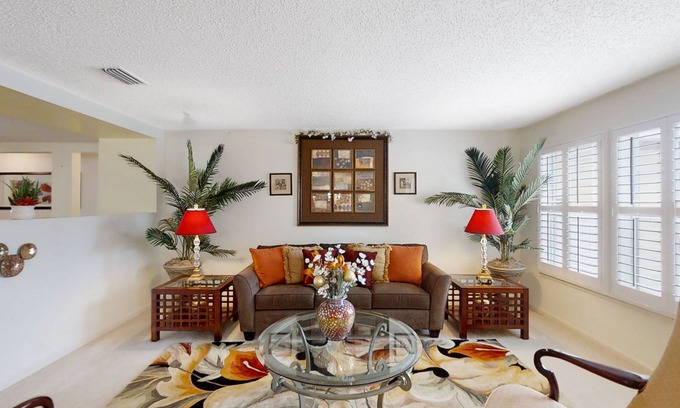 Westside House | Spacious home with sunroom, patio, fireplace, & water views