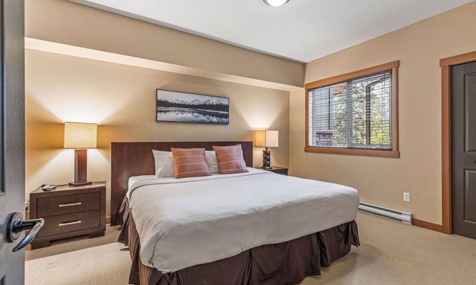Canmore Apartment | Spacious King Bed with Pool & Hot Tubs
