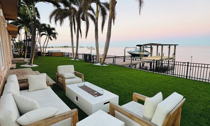 St. Petersburg House | Spacious Waterfront Tropical Oasis: Hot Tub, Dock & Turf