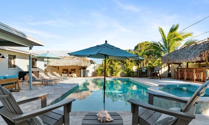 Naples Park House | Spared by Ian! Pool. Spa. Tiki! |Walk to Beach|Nina's Tiki Beach House
