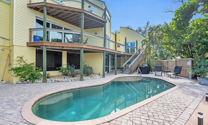 Mid Island House | spectacular architectural home steps to the beach w/private heated pool on canal