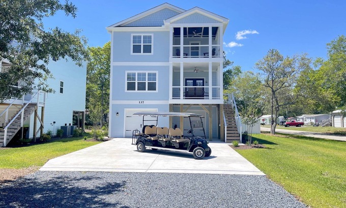 Tranquil Harbour House | Spectacular home with Pool, New 8 seater Golf Cart, elevator, with easy access to beach