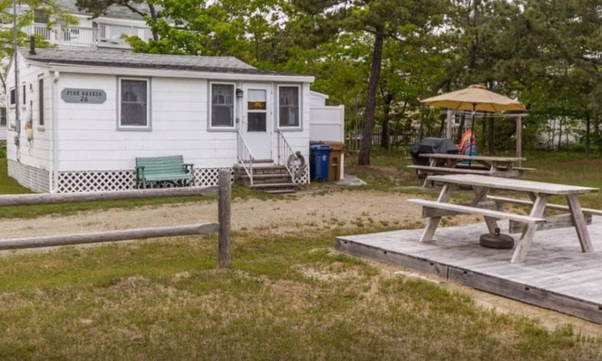 Southern Coast Cottage | Steps to the beach with beautiful ocean and lighthouse views from the yard