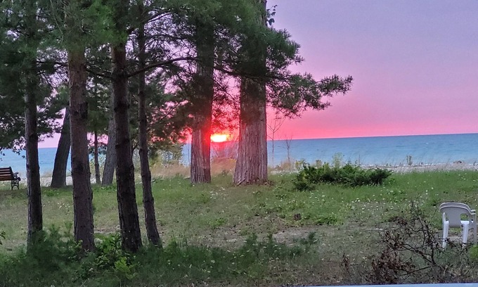 Kincardine Cottage | Stoney Island Sunsets. Blue Nugget is located on the sandy shores of Lake Huron.
