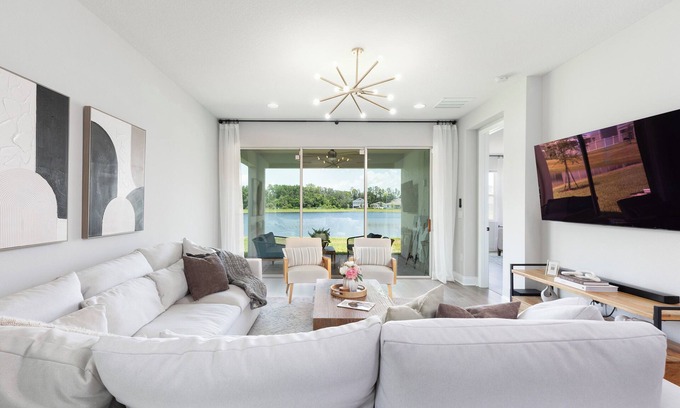 DeBary House | Stylish waterside retreat - springs nearby - pool and gym access - large groups