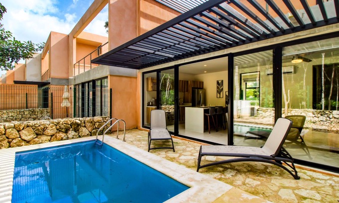 Tulum House | Sun-filled & dog-friendly resort home with outdoor pool, gym, patio, & courts