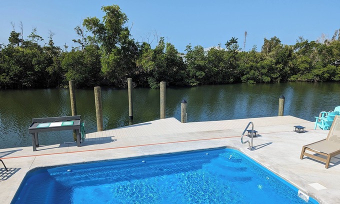Saint James City Cottage | Tangerine Dream Tropical Pool and Canal Retreat