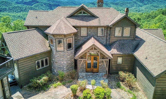 Sevierville Cabin | The King Of The Mountain-Breathtaking Views, 6617 Sq. Ft. Theater Room, Pool!