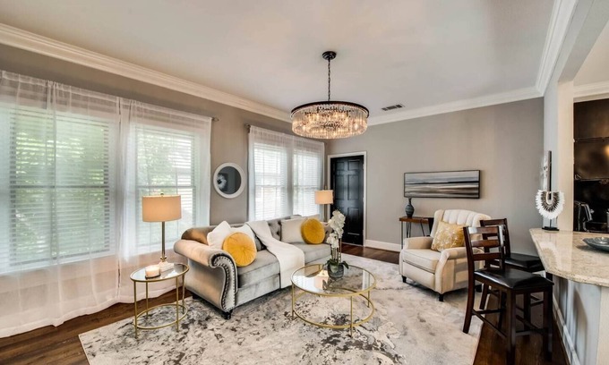 Old East Dallas Condo | The main living area includes a spacious living room, dining area, and spa-inspired bathroom. Guests enjoy complimentary high-speed WiFi, washer/dryer, and all essential amenities for comfort and convenience.