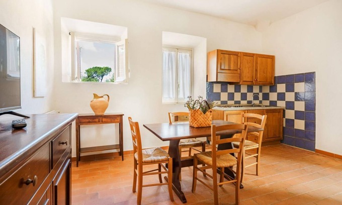 Pian dei Mucini Apartment | Three-room apartment on the ground or first floor in rustic style of approximately 40 m2 furnished in a simple but functional way and located in the village in a large park.It is composed of a living room with sofa and flat-screen television, kitchenette