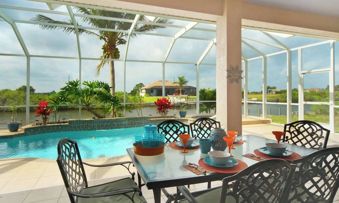 Burnt Store House | Tommy Bahama-style electric-heated pool home on Gulf-access canal - Villa Ellis