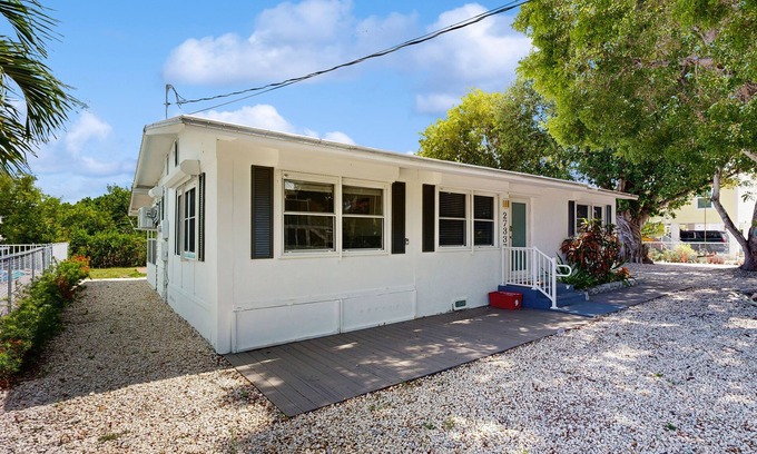 Breezeswept Beach Estates House | Tranquil Florida home with waterfront views, pool table & Wifi