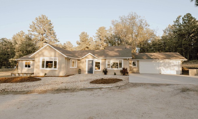 Colorado Springs Cottage | Tranquil Forest Retreat: Designer 4-Bedroom Ranch with Hot Tub & Firepit