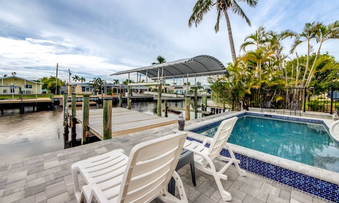 Matlacha House | Tropical Oasis Pool Kayak Bikes fish from dock
