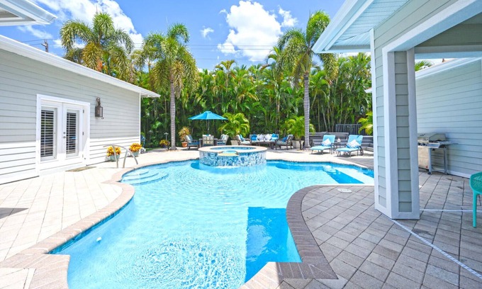 Naples House | Unique Moorings home with personal gym, newly remodeled pool, 4 ensuite bedrooms