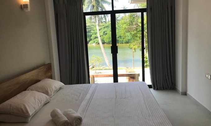 Hikkaduwa Villa | Unwind and relax with your whole family at our villa facing the river!n