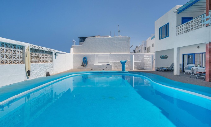 La Santa House | Vacation Home 'La Santa' with Sea View, Shared Pool and Wi-Fi