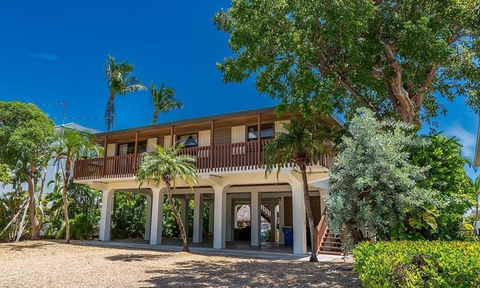 Venetian Shores House | Venetian Shores Retreat with Boat Lift, Tiki Hut & Hot Tub
