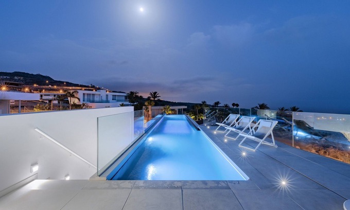 Guia de Isora Villa | Villa Abama Golf | Ocean Views | 18-Meter Infinity Pool with Glass Floor | Spacious Living and Dining Areas | Solarium and Outdoor Terraces | Tenerife