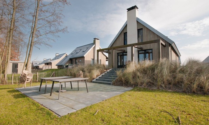 Tholen House | Villa in Netherlands with Waterfront Garden