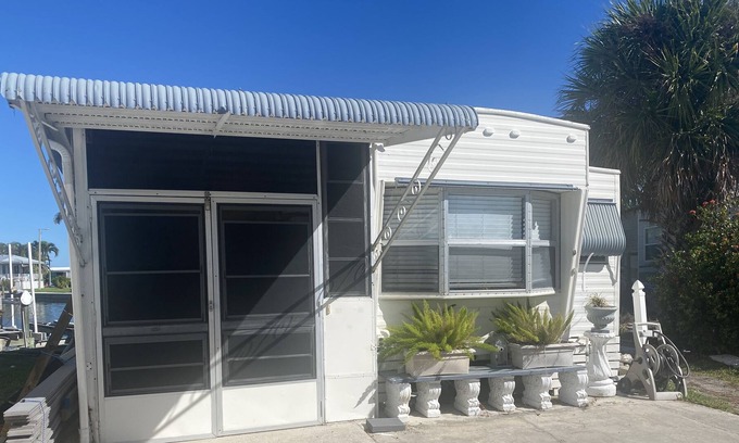 Nettles Island Cottage | Vintage cozy beach house waterfront on grand canal with dock