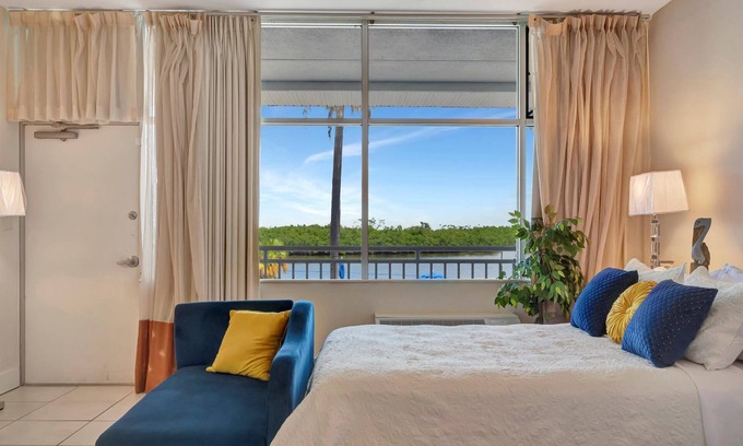 Ruskin Apartment | Watch the dolphins! Large balcony Suite and heated pool!