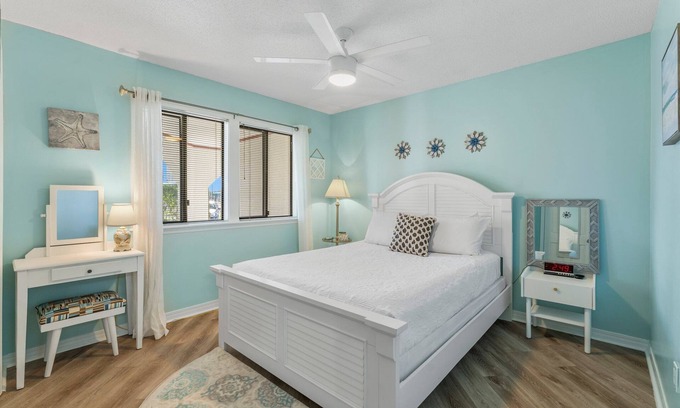 Thomas Drive Condo | Waterfront boat dock,very close to beach, pool, tennis courts, and sauna.