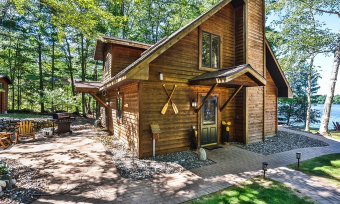 Eagle River Cottage | Waterfront getaway with wood fireplace, dock, & lakeside deck