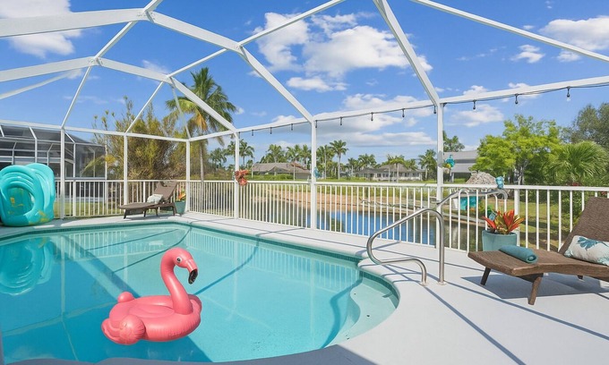 Pelican House | Waterfront Gulf-Access Escape | Heated Pool Dock Game Room + Tiki Bar