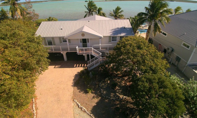 Bay Point House | Waterfront home with open water view, dock, hot tub, private beach, dog friendly