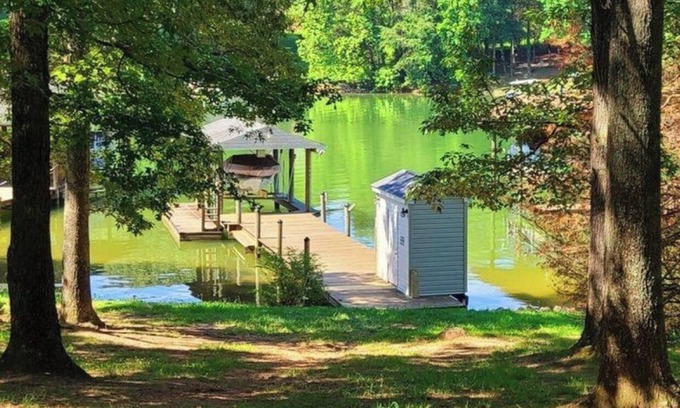 Smith Mountain Lake House | Waterfront house with dock, level lot, kayaks, park like setting, boat parking