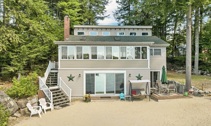 Moultonborough House | Winnipesaukee Lake Front Cottage with Sandy Beach and 25ft Dock Sleeps 8