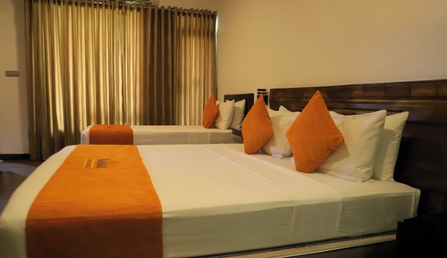 Deluxe Triple Room, Balcony, Garden View