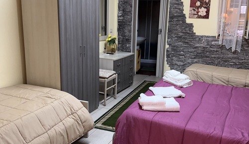 Deluxe Quadruple Room, Patio, City View