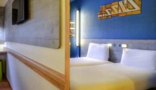 Room with One Queen Bed and One Bunk Bed