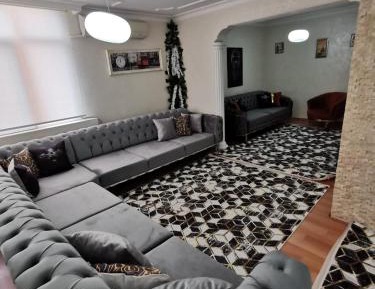 Four-Bedroom Apartment with Balcony 