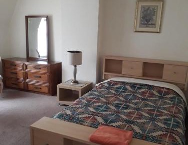 Queen Room with Shared Bathroom