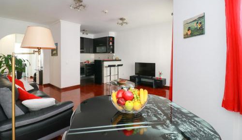 One-Bedroom Apartment with Balcony and City View