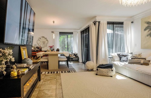 Lake Forest Condo | A Spacious room with artistic design and a bidet in the forest.