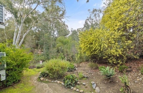 Lake Forest Condo | A Spacious room with artistic design and a bidet in the forest.
