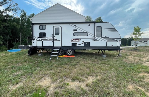 Lexington - Salisbury RV Rental | Come glamping in a Cozy 1-bedroom camper with double bunks and a sofa