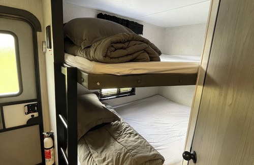 Lexington - Salisbury RV Rental | Come glamping in a Cozy 1-bedroom camper with double bunks and a sofa