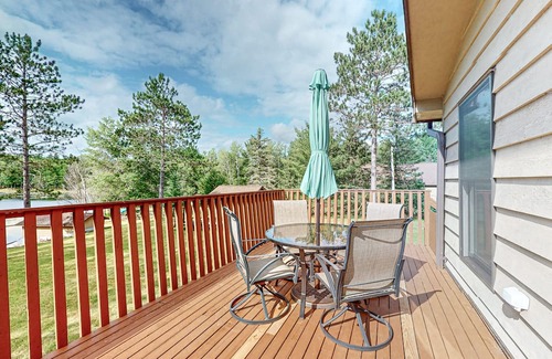 Hazelhurst House | Lakefront home with large patio, fire pit, air hockey & a provided peddle boat